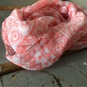 Light pink infinity scarf.
